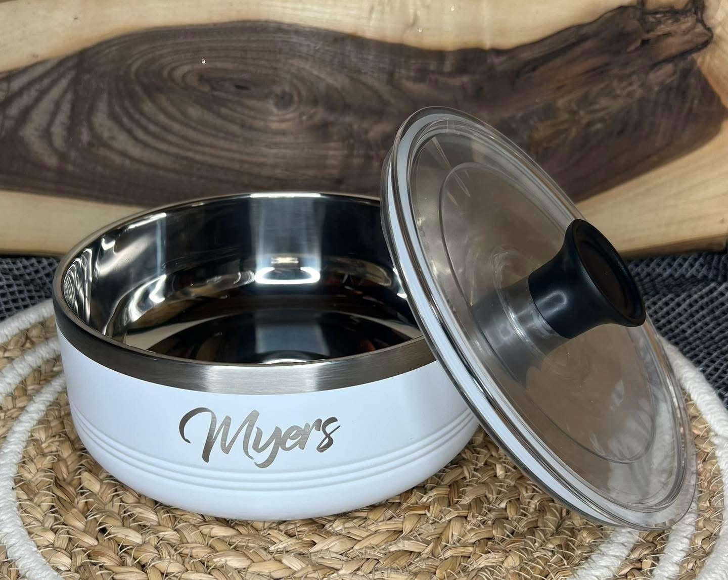 White pet bowl with 'Myer's' branding on a woven mat with a wooden background