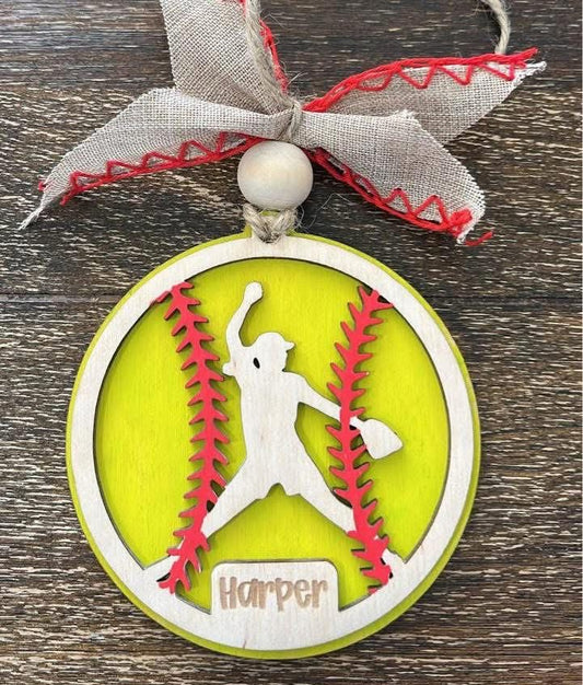 Decorative ornament with a silhouette of a player and 'Harper' text, on a wooden surface.